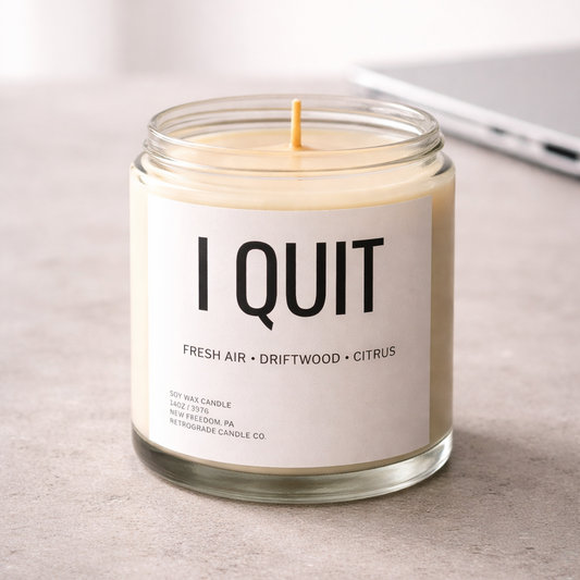 Candle with 'I Quit' label on a neutral background